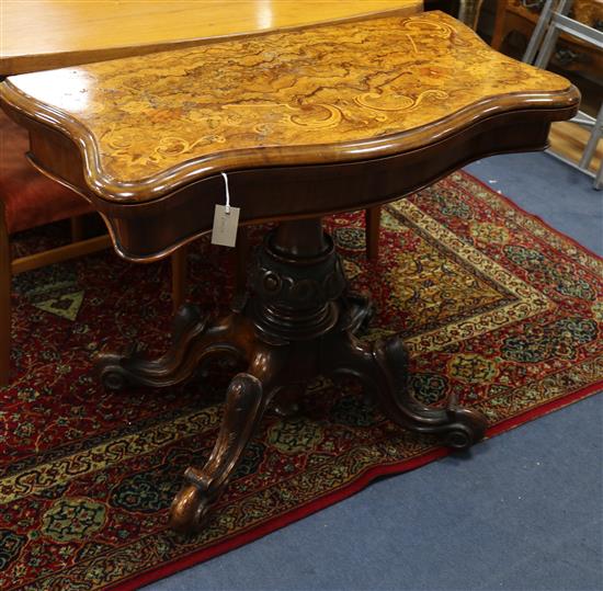 A Victorian burr walnut serpentine fronted folding card table W.92cm